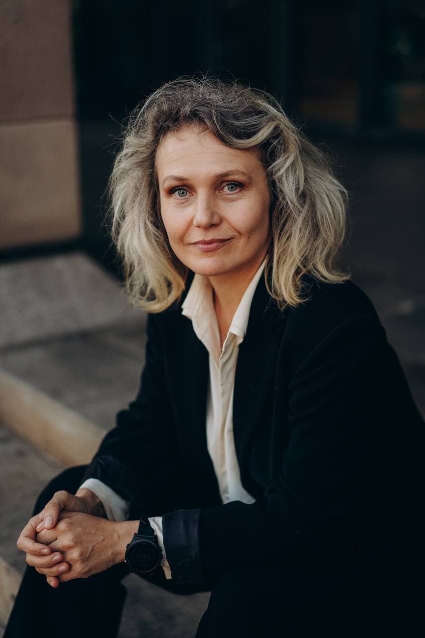 Yev Lukash speaking on stage in editorial portrait