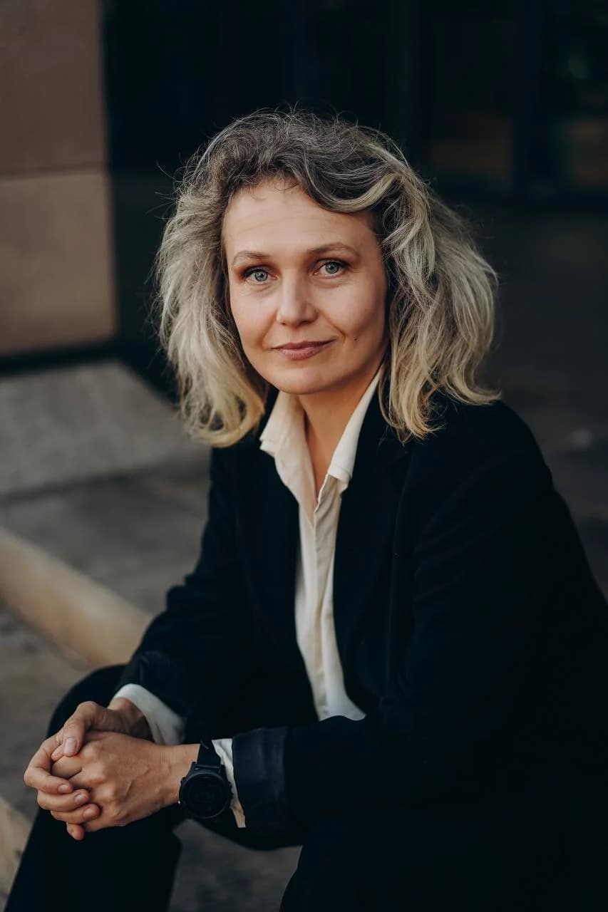 Yev Lukash speaking on stage in editorial portrait